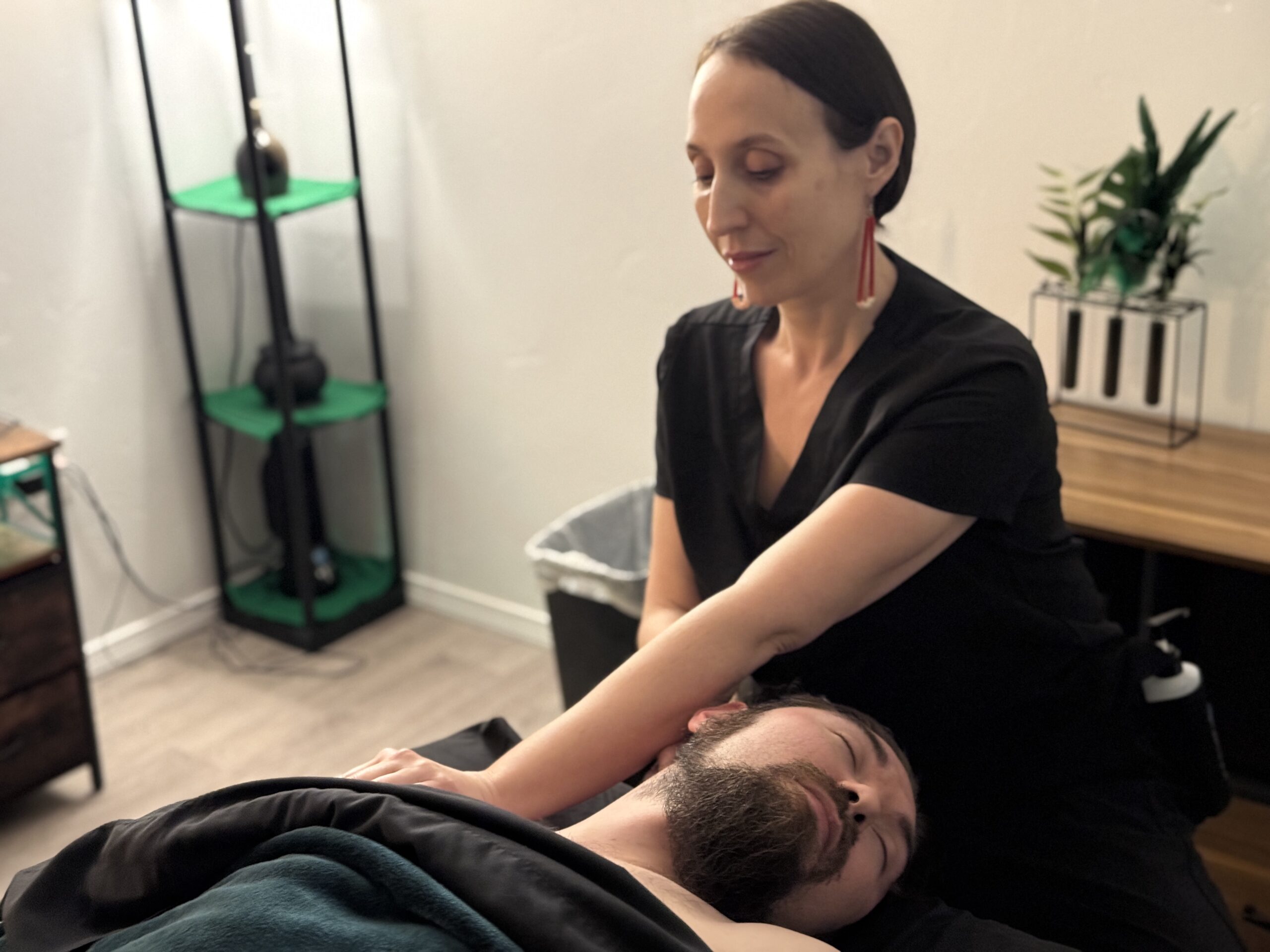 Woman giving a man a massage- Massage By Stephanie (Service)